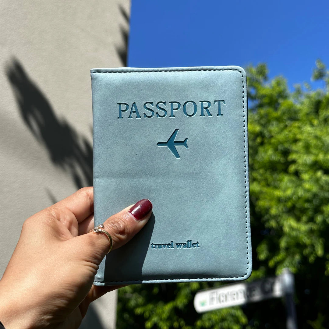 Hand holding Light Blue RFID Passport Holder